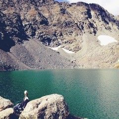 Jennifer Workman on a hike by lake in Colorado.