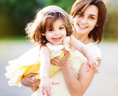 mother holding her daughter
