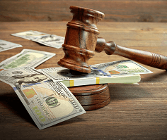gavel on top of money